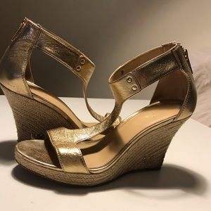 Micheal Kors gold wedges